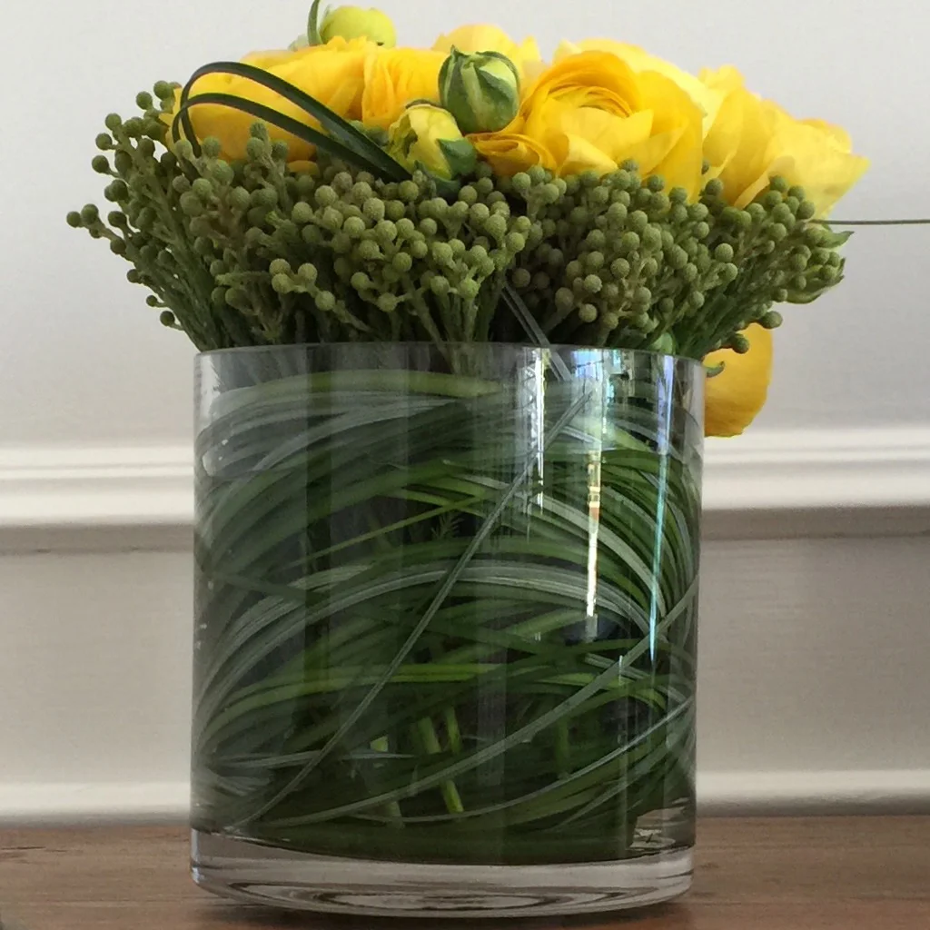 Yellow ranunculus crowned in green