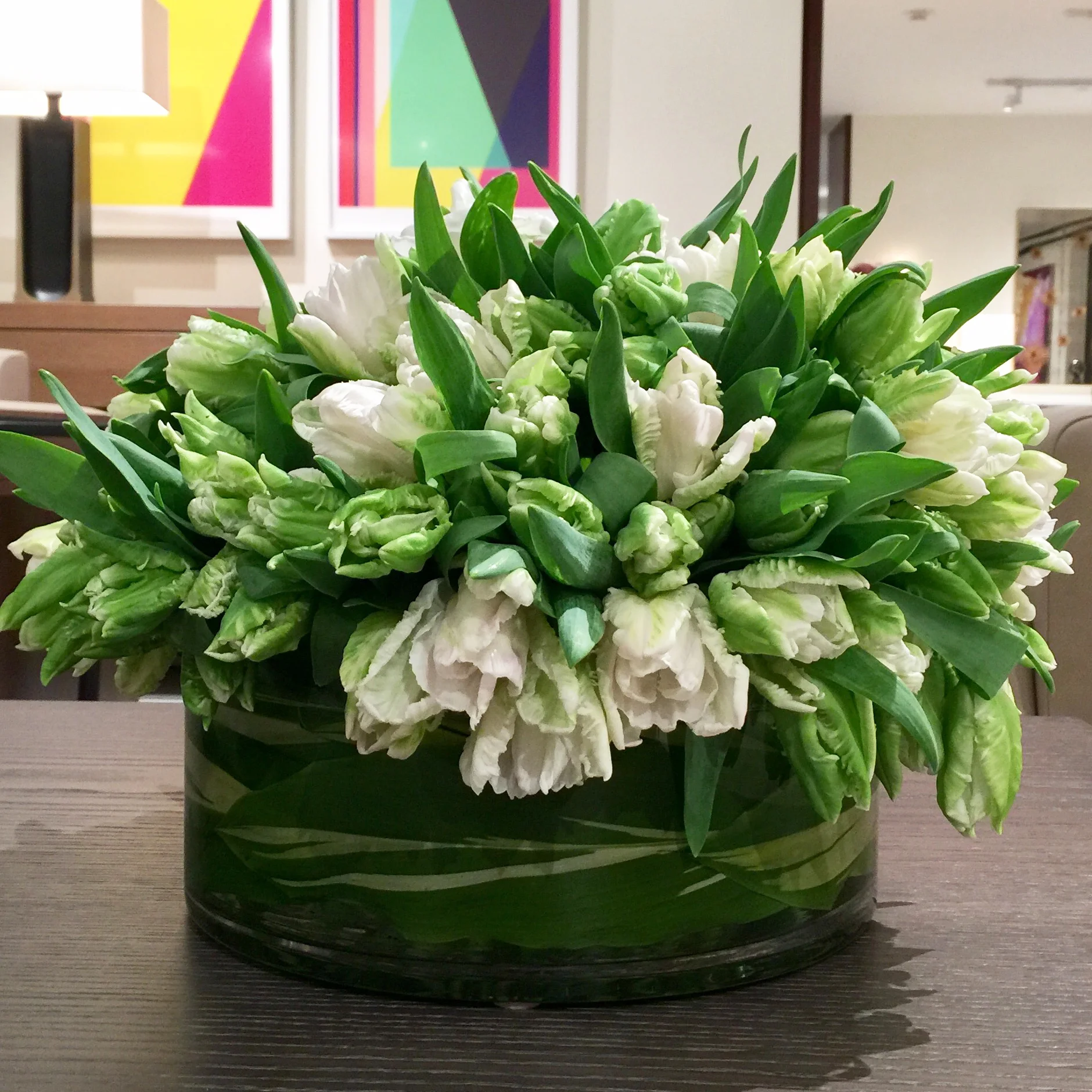 White tulips in a low glass bowl